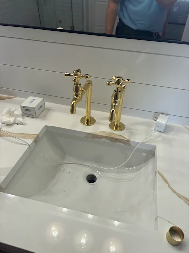 Luxury gold bathroom faucet and sink fixtures installed by Kabam Plumbing Services in Sun City Center FL