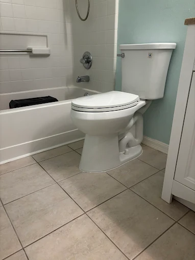 Professional toilet installation in Florida bathroom by Kabam Plumbing Services