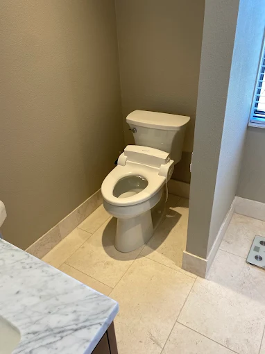 New toilet installed in residential bathroom - Kabam Plumbing toilet repair service Sun City Center